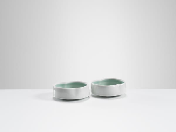 Chris Keenan, 21-22 Pair of Celadon Cloud dishes with deeper celadon 'script'