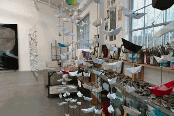 Detail of a room with paper boats in the artist Enrique Martinez Celaya’s Los Angeles studio. Image courtesy the artist.