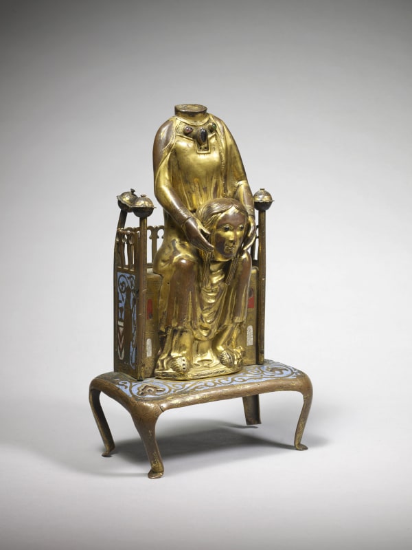 Saint Valerie holding her head, French, late 19th century, in the style of Limoges 13th century, copper, golded with champlevé enamel, glass beads and gems; h. 28 cm x w. 16.3 cm (base), w. 11.5 cm (throne)