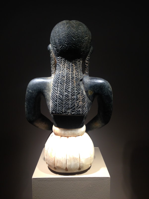 Image above: Inv. 2086 Seated Male Figure, Back View