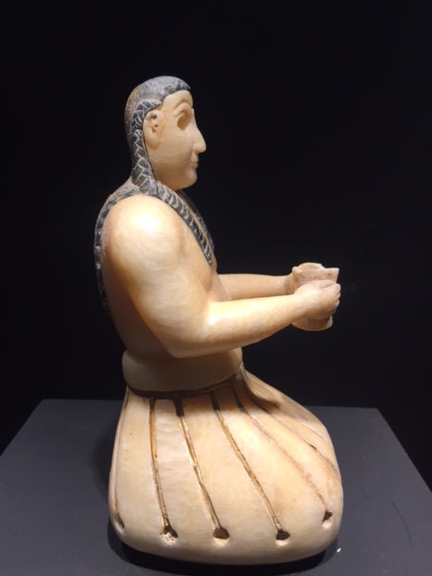 Image above: Inv. 2496.1, Seated Male Figure Holding a Cup, Side View