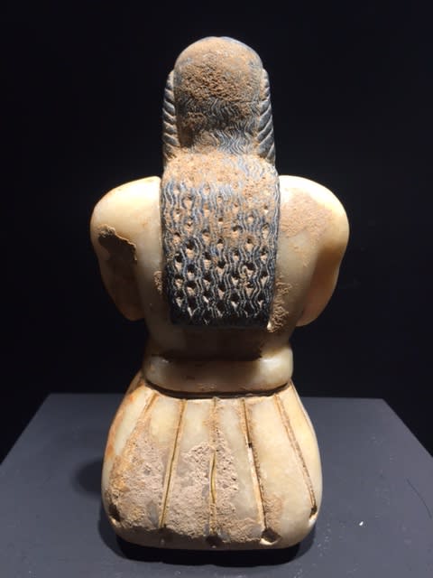Image above: Inv. 2496.1, Seated Male Figure Holding a Cup, Back View