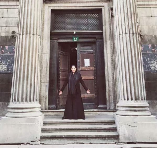 Marina Abramović in front of BANK's original site in Xianggang Rd., Shanghai. Courtesy of BANK.