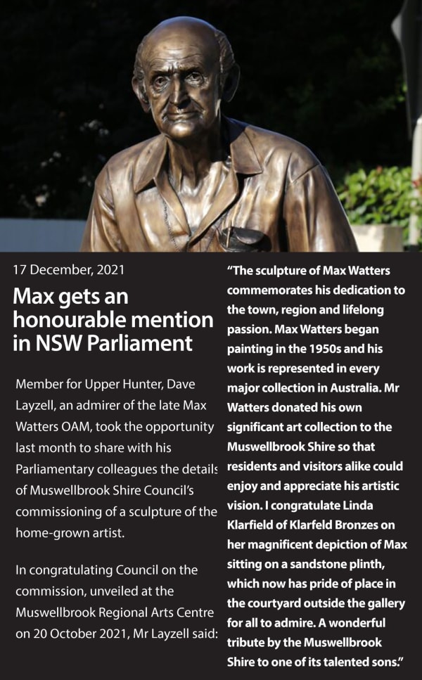 An article titled "Max gets an honourable mention in NSW Parliament," dated 17 December 2021, featuring a bronze sculpture of Max Watters, a late artist, sitting on a sandstone plinth. The sculpture commemorates his dedication to the town, region, and lif