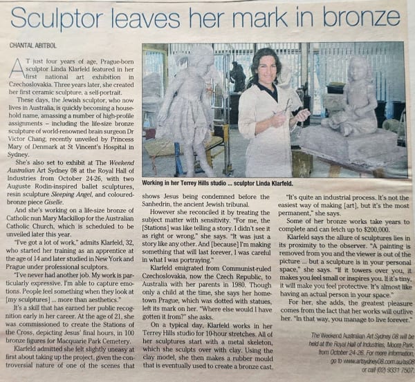 An article titled "Sculptor leaves her mark in bronze" featuring Linda Klarfeld, a Prague-born sculptor based in Australia, holding sculpting tools in her Terrey Hills studio. Behind her are works in progress, including life-size and smaller figurative sc