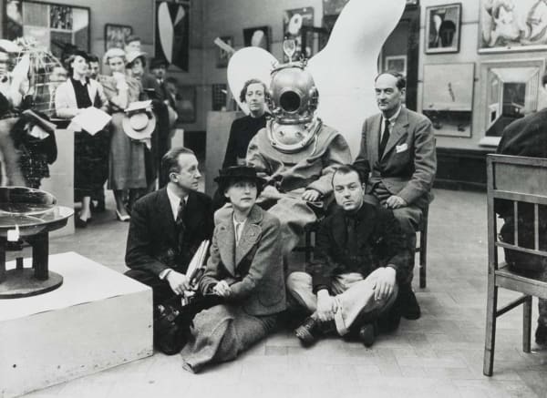 Salvador Dalí in diving suit and helmet with Paul and Nusch Eluard, ELT Mesens, Diana Brinton Lee and Rupert Lee, 1936