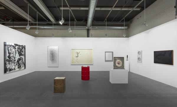 Sprovieri’s booth at Art Basel 2024. Artwork, left to right: Jannis Kounellis, Untitled, 2010; Giuseppe Penone, Acero (Maple), 2005; Francesco Arena, A Marat, 2023; Jannis Kounellis, Untitled, 1960; Jimmie Durham, Coins Only, 2010; Lucio Fontana, Concetto spaziale, Attese, 1964/65; Lucio Fontana, Concetto Spaziale (52 B 4), 1952; Giorgio Andreotta Calò, Pinna Nobilis (Z), 2018; Dadamaino, Volume, 1960; Alberto Burri, Nero Catrame, 1950. Photo: Sebastiano Pellion di Persano