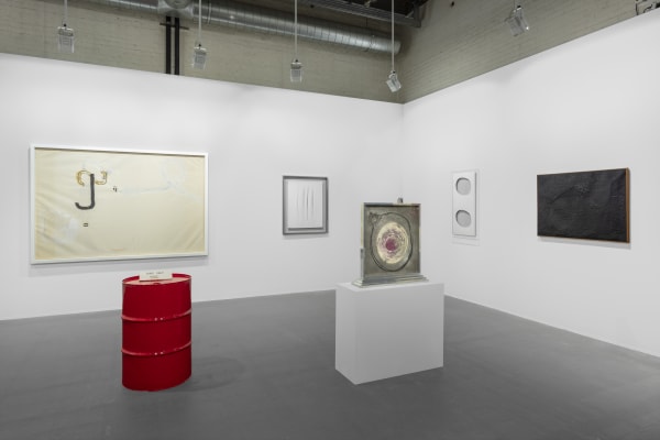 Sprovieri’s booth at Art Basel 2024. Artwork, left to right: Jannis Kounellis, Untitled, 1960; Jimmie Durham, Coins Only, 2010; Lucio Fontana, Concetto spaziale, Attese, 1964/65; Lucio Fontana, Concetto Spaziale (52 B 4), 1952; Alberto Burri, Nero Catrame, 1950. Photo: Sebastiano Pellion di Persano