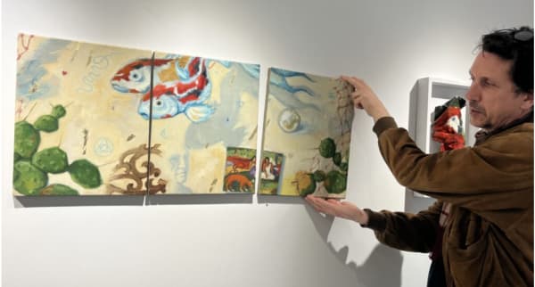 Rupert Shrive with “Infinity triptych”, oil on linen, 2023, which can be moved around indefinitely