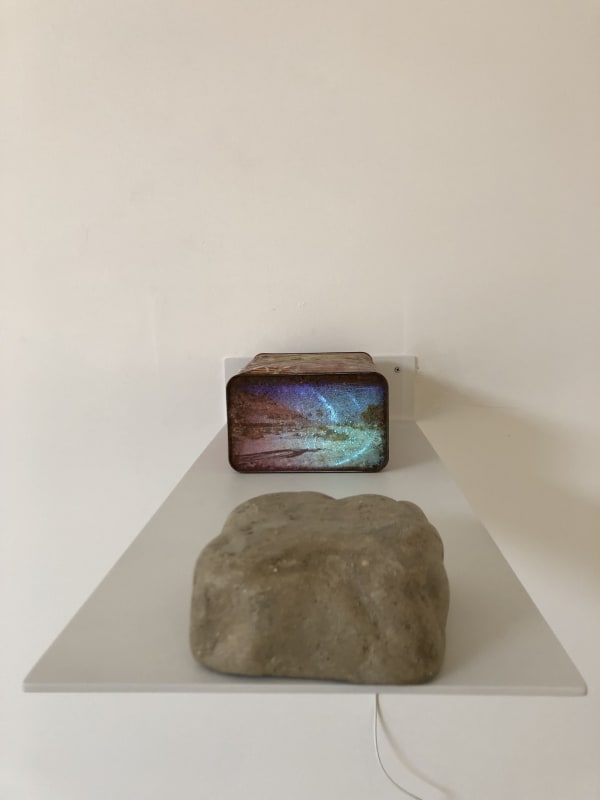 Pipelines And Sinkholes #3, 2019 White Aluminum 11" x 26" Floating Shelf ,Rusted 1 gallon gasoline can ,video projector with usb, 3:00 single Channel video