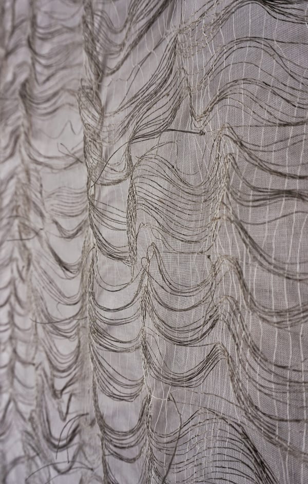 Using natural materials, a subtle palette, swathes of delicate yarns, and ethereal woven structures, Saskia Saunders sensitively interpreted the delicate balance of personal and environmental wellbeing. Alun Callender Photography, 2025. Copyright © 2025 Les Bois Magazine. All rights reserved. Photo by Alun Callender.