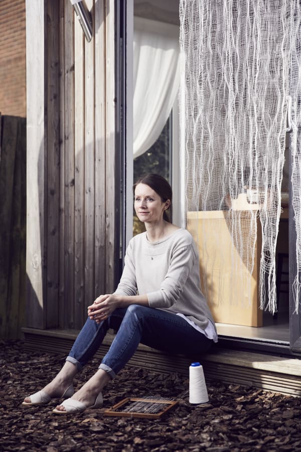 Saskia Saunders, captured in a quiet moment outside her studio, reflecting on the connection between art, nature, and sustainability. Alun Callender Photography, 2025. Copyright © 2025 Les Bois Magazine. All rights reserved. Photo by Alun Callender.