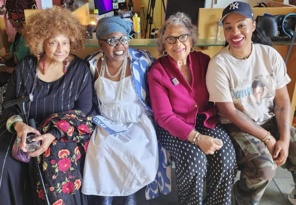 (L-r): An opening reception of COLAB: Art and Music from Baltimore and Beyond was held at the Eubie Blake National Jazz Institute and Cultural Center on Saturday, May 17, 2025. Nearly 200 art enthusiasts, cultural leaders, and artists attended the multisensory exhibition. (L-r): Multimedia artist Joyce J. Scott; Kibibi Ajanku, textile artist; Alma Roberts, abstract painter; and Megan Lewis, Contemporary painter shared a celebratory moment reflecting on the multi-generational legacy of the Eubie Blake Cultural Center. COLAB will remain on view at the Eubie Blake Cultural Center through August 16, 2025. Photo credit: Catalina Byrd