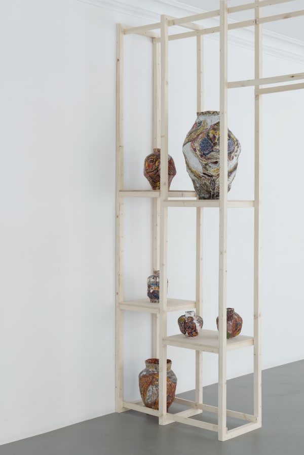 Installation photograph of Karim Boumjimar’s 2025 exhibition Mouths, Vessels, Portals at Alice Folker Gallery, Copenhagen, with wall drawings and ceramic sculptures.