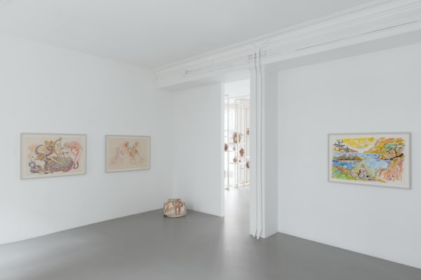 Gallery view of Karim Boumjimar’s Mouths, Vessels, Portals (2025), featuring framed works on paper alongside earthenware sculptures.
