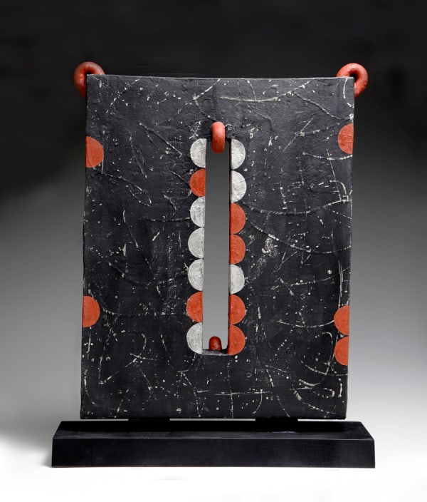 WORK 16-17; Black screen-like sculpture with silver calligraphic decoration and central rectangular perforation framed with semi-circles in silver and red 2016 Glazed stoneware with wooden base 21 1/2 x 16 1/8 x 2 1/8 in.; 24 x 18 7/8 x 5 7/8 in. (incl. wooden base) Inv# 9908