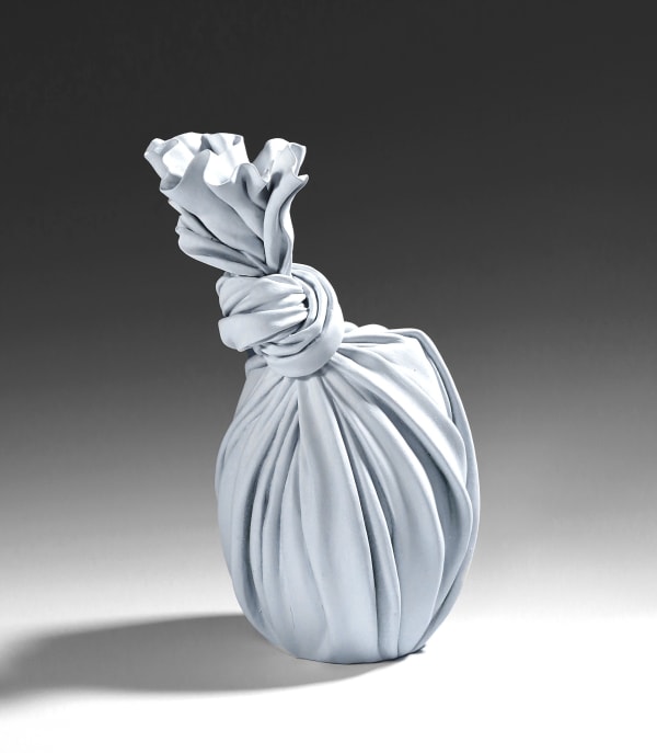 Tanaka Yū (b. 1989) White sculpture in the shape of a knotted furoshiki (wrapping cloth) enclosing a vessel 2020 Matte-glazed stoneware 12 1/4 x 7 3/4 x 7 7/8 in. Inv# 11729 SOLD