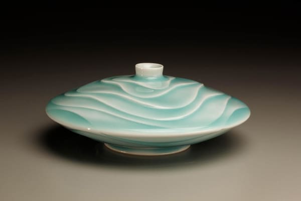 Ono Kotaro (b. 1953) Low, round flower vessel with blue-green celadon glaze Porcelain with seihakuji glaze 2 1/8 x 5 7/8 x 5 7/8 inches Inv# 6083