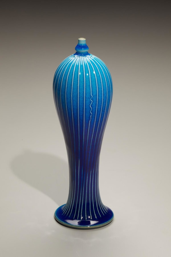 Kimura Yoshiro (b. 1946) Small standing striped vessel with tiny mouth, tapering base at flaring foot 2009 Porcelain with cobalt-blue glaze 8 1/8 x 2 1/2 inches Inv# 6466
