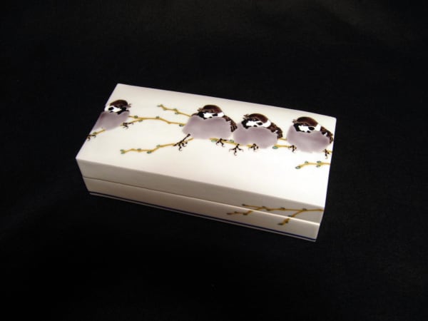 Covered rectangular box decorated with sparrows perched on branches, 2010 Porcelain with polychrome enamel glazes 2 1/2 x 8 1/8 x 3 7/8 inches Inv# 6693 SOLD