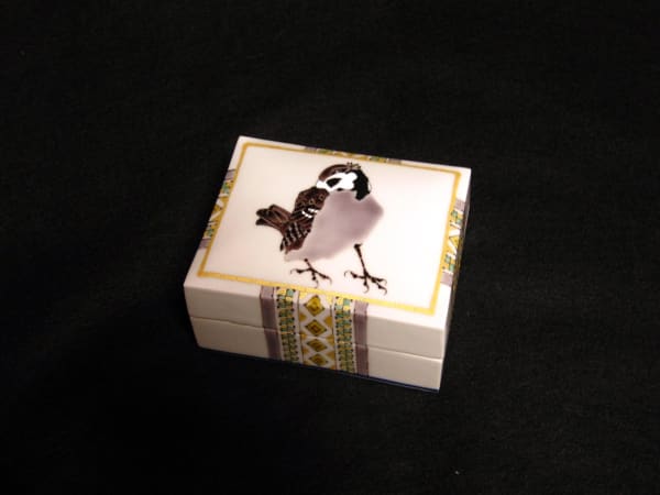 Small square covered box decorated with a sparrow and decorative banding, 2010 Porcelain with polychrome enamel glazes 2 3/8 x 4 3/8 x 3 3/8 inches Inv# 6694 SOLD