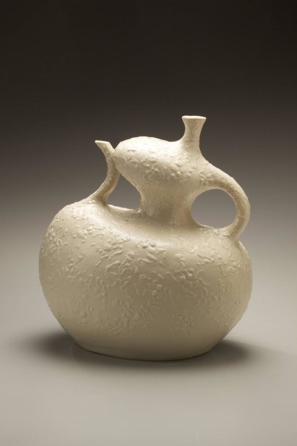 Kawamoto Gorô (1919 - 1986) Attenuated and animated pouring vessel with surface decoration of dancing figure done in relief ca. 1976 Porcelain 10 1/4 x 6 1/2 x 11 3/8 inches Inv# 6203