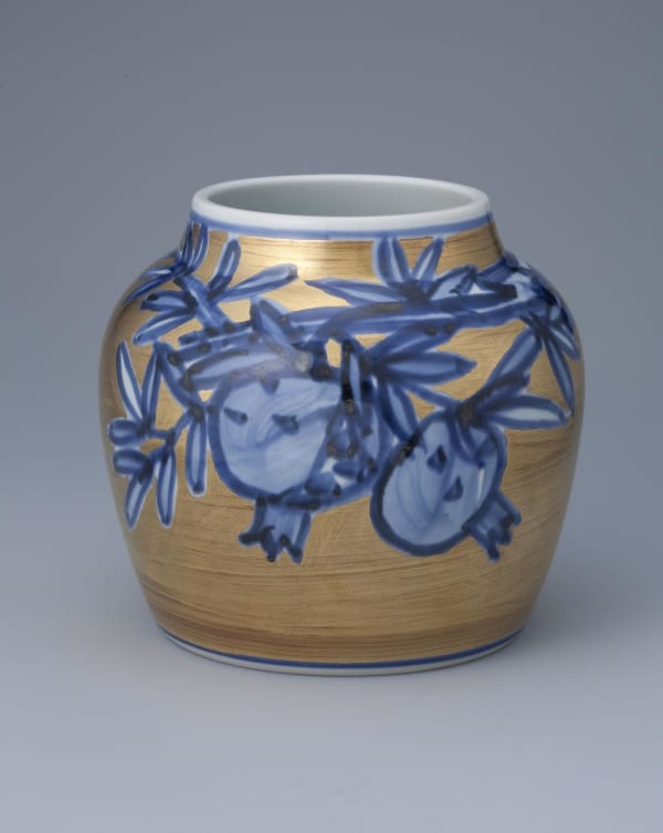 Kondo Yuzo (1902 - 1985) Gold overglazed porcelain vase with cobalt blue underglaze decoration of pomegrantes, ca. 1978 Glazed Porcelain 8 1/4 x 9 1/4 inches SOLD