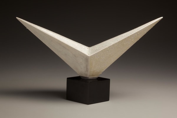 Kondô Takahiro (b. 1958) V-shaped white glazed porcelain form with gold and silver mist over-glazes and black cast glass base, 2010 Porcelain with white and metallic glazes 6 1/4 x 17 3/4 x 5 1/8 inches Inv# 6728;SOLD