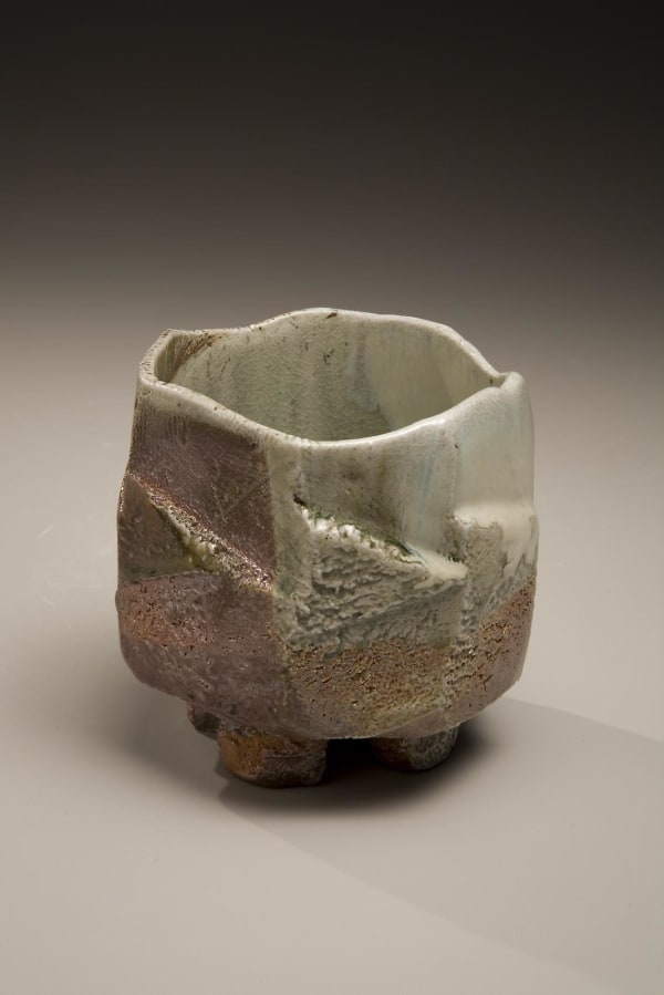 Tamba ware glazed footed teabowl with faceted carved exterior, 2007 Wood-fired stoneware with creamy ladle-poured ash and iron-oxide glazes 3 7/8 x 5 1/2 x 5 inches Inv# 5645 SOLD