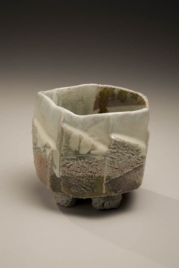 Tamba ware glazed footed teabowl with faceted carved exterior, 2007 Wood-fired stoneware with creamy ladle-poured ash and iron-oxide glazes 3 7/8 x 5 1/2 x 5 inches Inv# 5645 SOLD