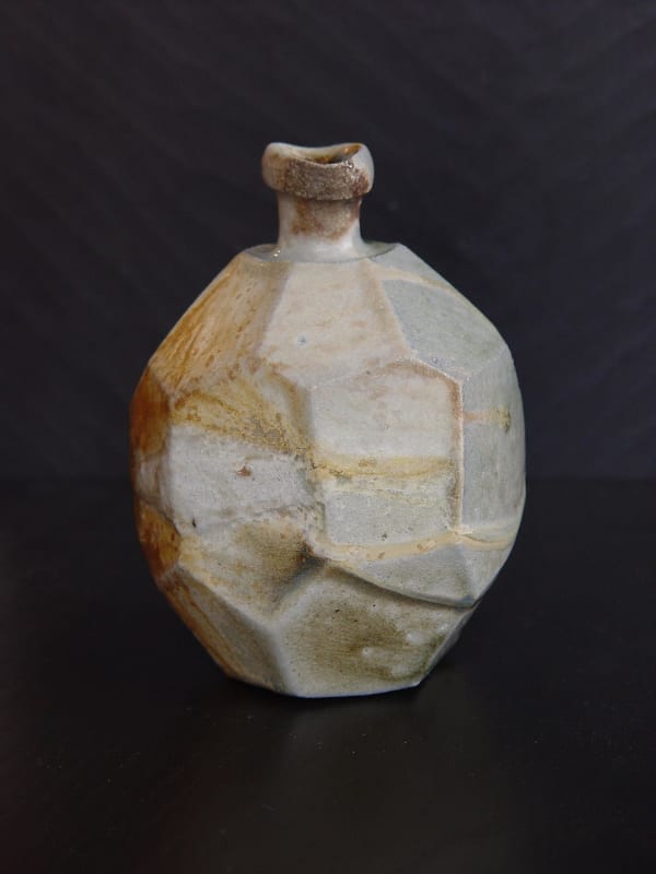Faceted Tanba tokkuri (sake flask) with light-colored natural ash glaze, 2011 Wood-fired stoneware with natural ash glaze and kiln effects 6 x 4 1/2 inches; Inv# 6935 SOLD