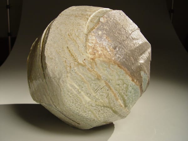 Spherical Tanba vessel with faceted diagonal banding and dripping natural ash glaze and markings from impressed shells, 2011 Wood-fired stoneware with natural ash glaze 13 1/2 x 14 1/2 inches; Inv# 6888 SOLD