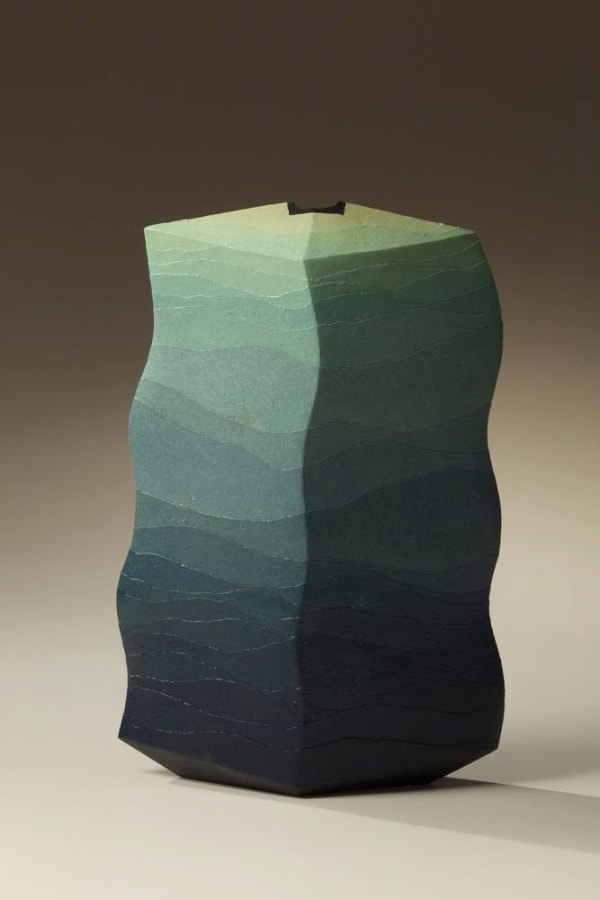 Miyashita Zenji (1939-2012) Flattened diamond vessel with undulating edges and covered in carved bands of clay in hues from dark blue to pale green, 2012 16 3/8 x 11 x 4 3/8 in. Inv# 7691
