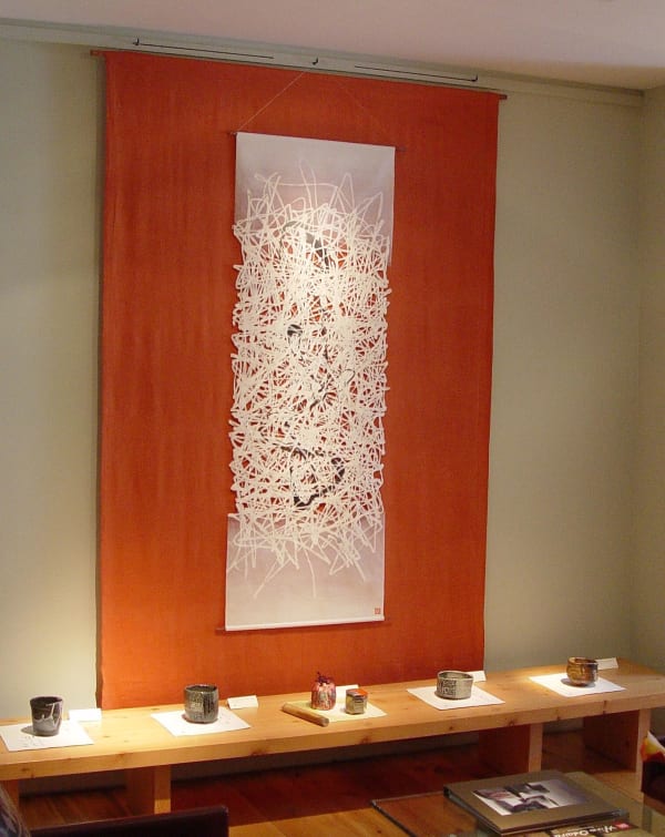 Washi paper works by Hiro Odaira, of Precious Pieces, create dividers and wall accents for the gallery.