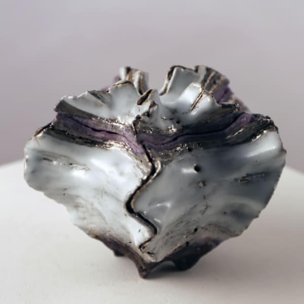 Small, covered shell-shaped container with purple and silver glazes along the mouth 2013 Glazed stoneware 5 1/8 x 6 1/4 x 5 7/8 in. Inv# 8225