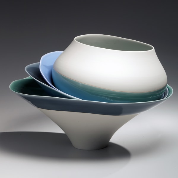 Two shallow and one rounded bowls unevenly set within a deep, narrow-footed vessel 2013 Unglazed porcelain with blue and teal glaze 15 x 21 5/8 in. Inv# 8345