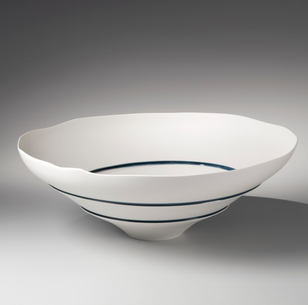 Unglazed narrow-footed bowl cut in three sections and joined together by bands of blue 2014 Unglazed porcelain with seams of blue glaze 6 3/4 x 18 1/2 x 18 1/2 in. Inv# 8563