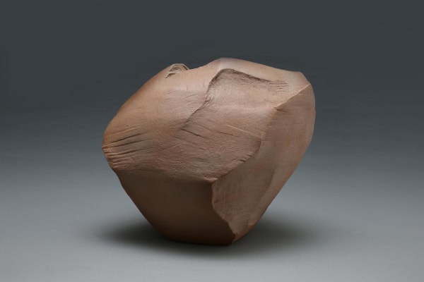 Angled rock-like, scooped-out, sculptural vessel with tapered base, striations in the body and Hagi kohiki glaze in naturalistic tones of brown and rust, 2014 Glazed stoneware 14 1/2 x 17 1/4 x 13 1/4 in. Inv# 9031