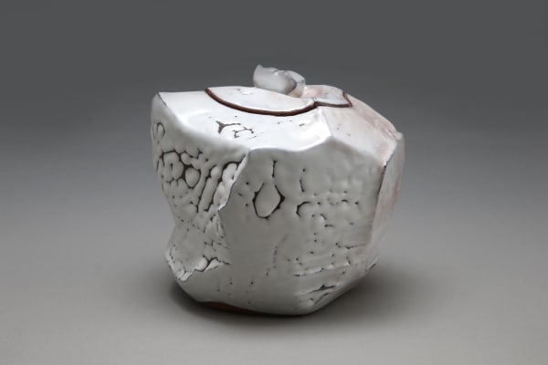 Sculpted covered waterjar with faceted sides, covered with crawling Hagi white glaze (kairagi) with pink tones, and kiln effects, 2013 Glazed stoneware 8 1/8 x 9 1/4 x 8 3/4 in. Inv# 9045