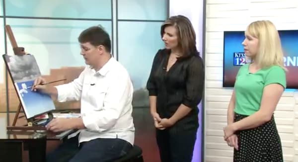 Painting clouds on KTXS news