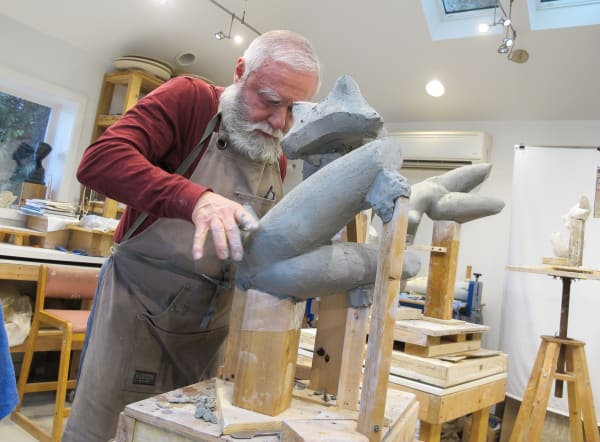Sculptor Emilio DiIorio working in his studios