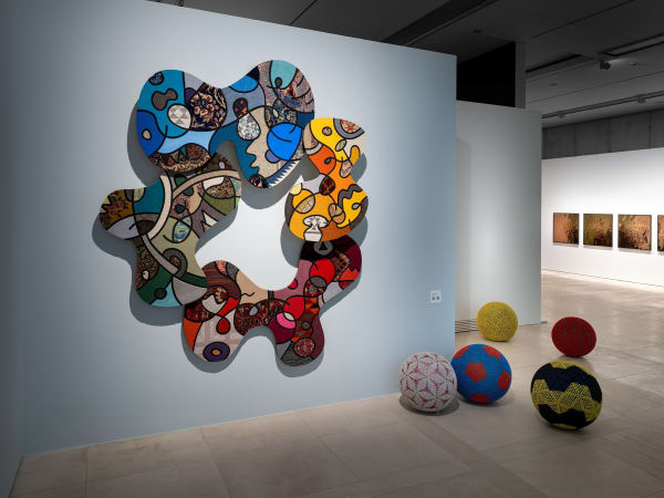 Installation view Nevin Aladağ – Interlocking with Social Fabric, Floating Leaves (2023), Crochet Balls (2023) and Stilettos (2017), © VG...
