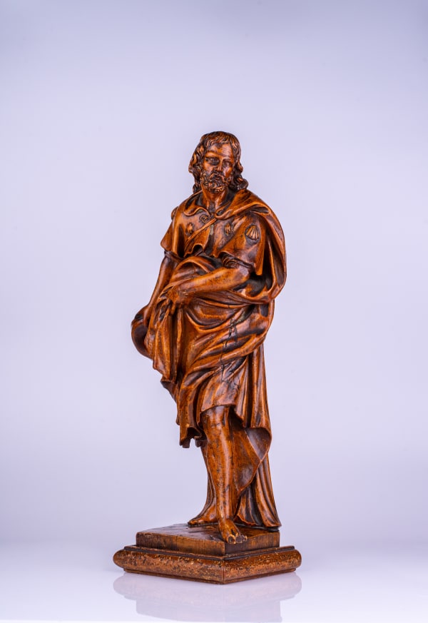 A Flemish carved and polished fruitwood figure of St James, 18th century