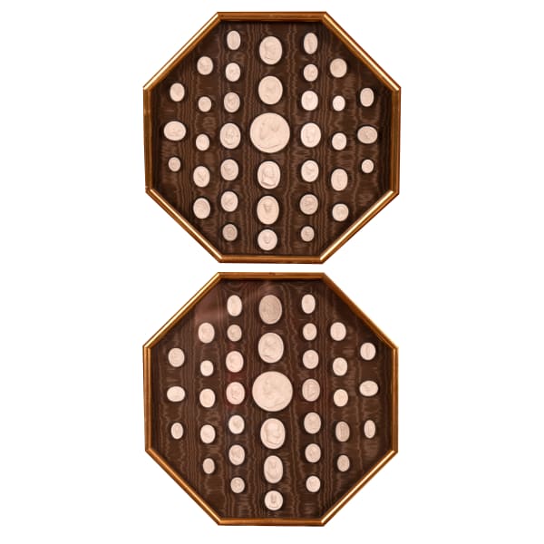 A pair of framed Italian plaster cameos