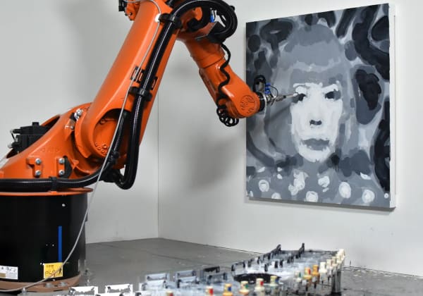 A robot painting a portrait of Yayoi Kusama by Rob and Nick Carter