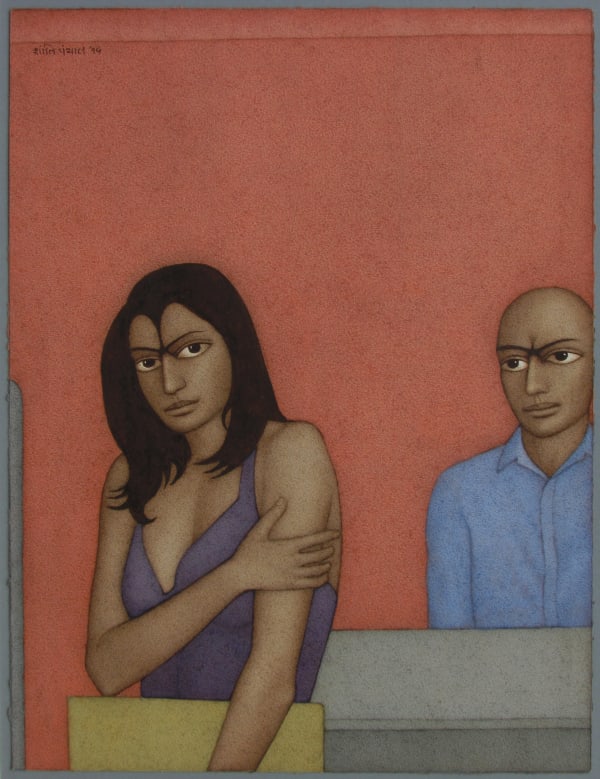 A young woman holds her body with her right arm, her left holding papers, she looks directly towards the observer. Behind her is a man behind a desk.