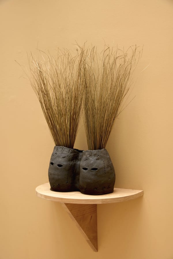 Lucía Pizzani Siamesas, 2024 Black stoneware clay and dried palm stems 36 x 22 x 76 cm 14 1/8 x 8 5/8 x 29 7/8 in