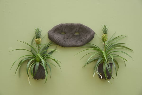 Lucía Pizzani Seres Tropicales, 2024 Mural installation, 10 black stoneware clay sculptures imprinted with corn, live plants Dimensions variable