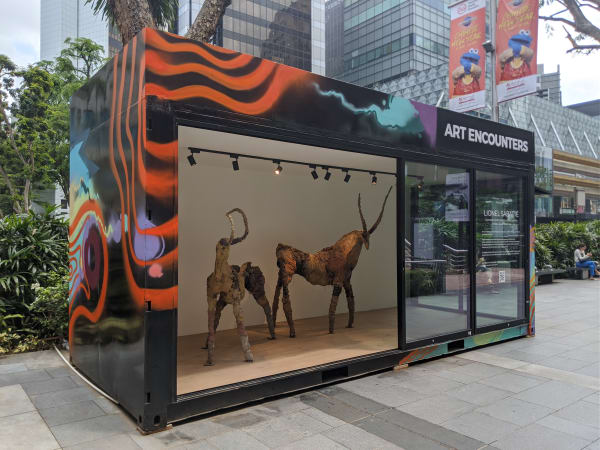 Lionel Sabatte and his completed Prehistoric Concrete Goats on Orchard Road