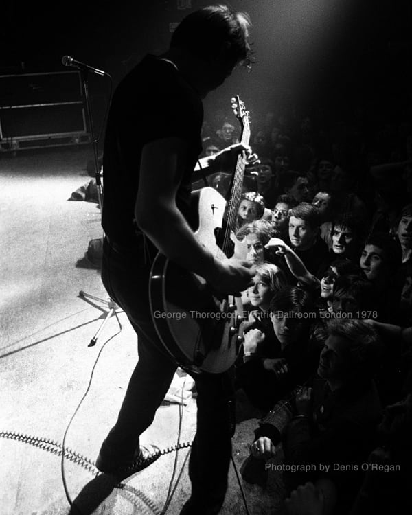 George Thorogood performing on stage